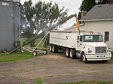 corn, via auger, from grain bin to truck